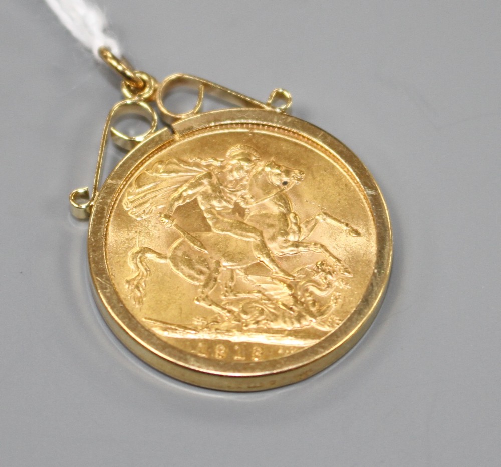 A George V 1913 gold full sovereign, in later 9ct gold pendant mount, gross weight 9.4 grams.